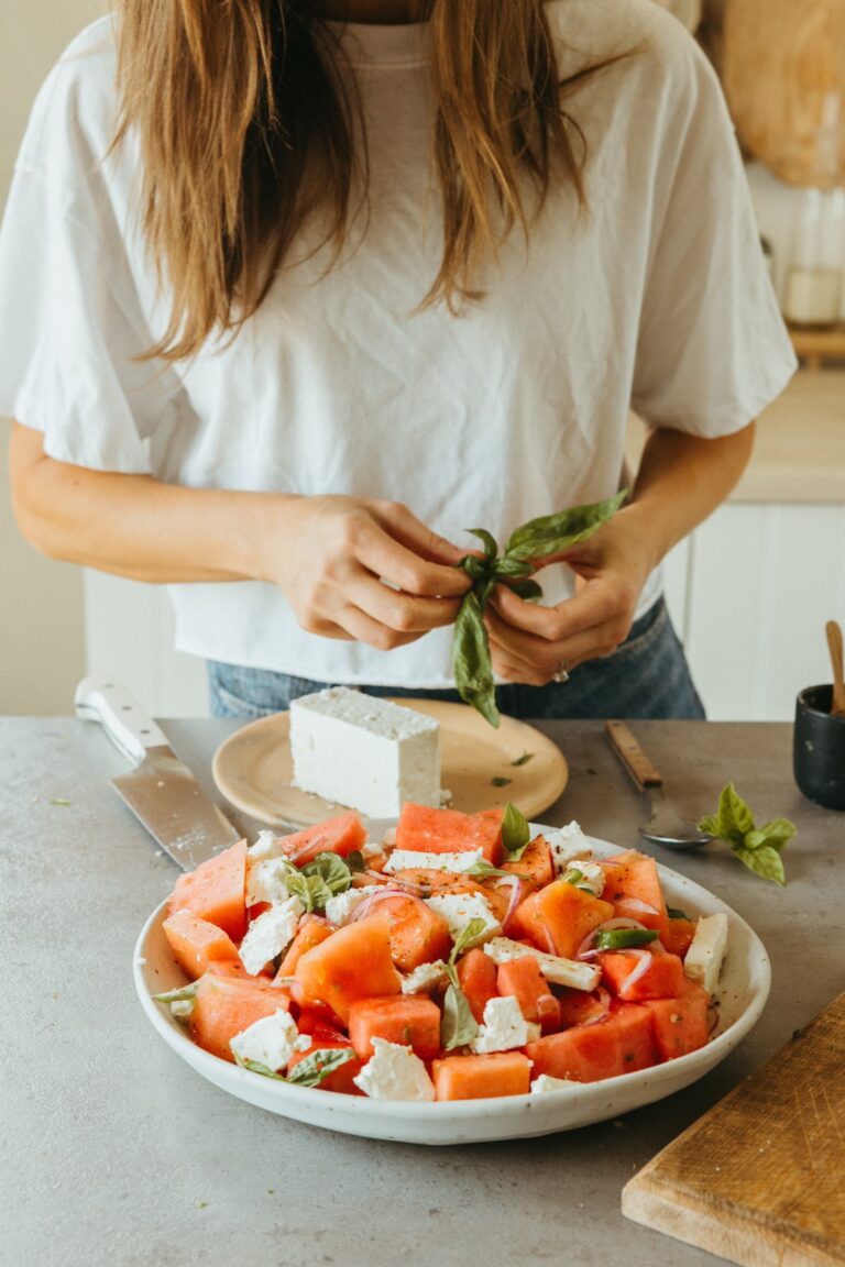 preparing spicy watermelon feta salad