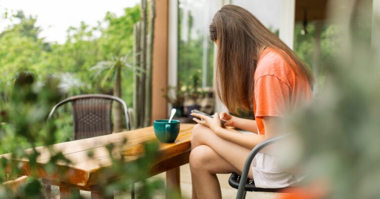 teenage girl sitting on